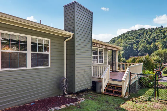 a couple of chairs in front of house
