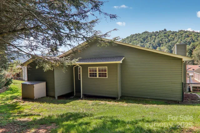 a backyard of a house with lots of green space