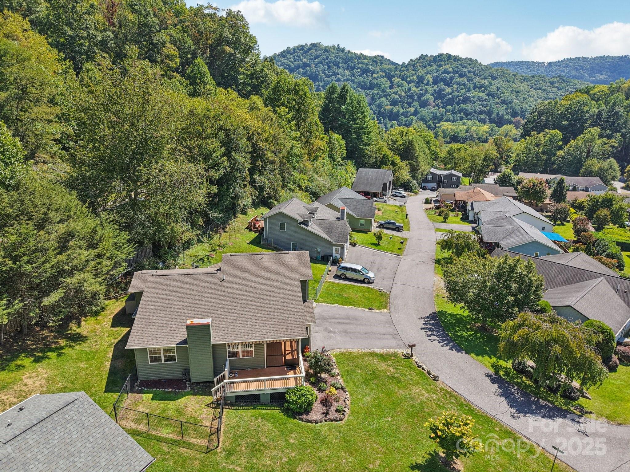 126 Pasco Loop Waynesville, NC 28785 - Photo 36 of 44 an aerial view of a house with swimming pool and mountains