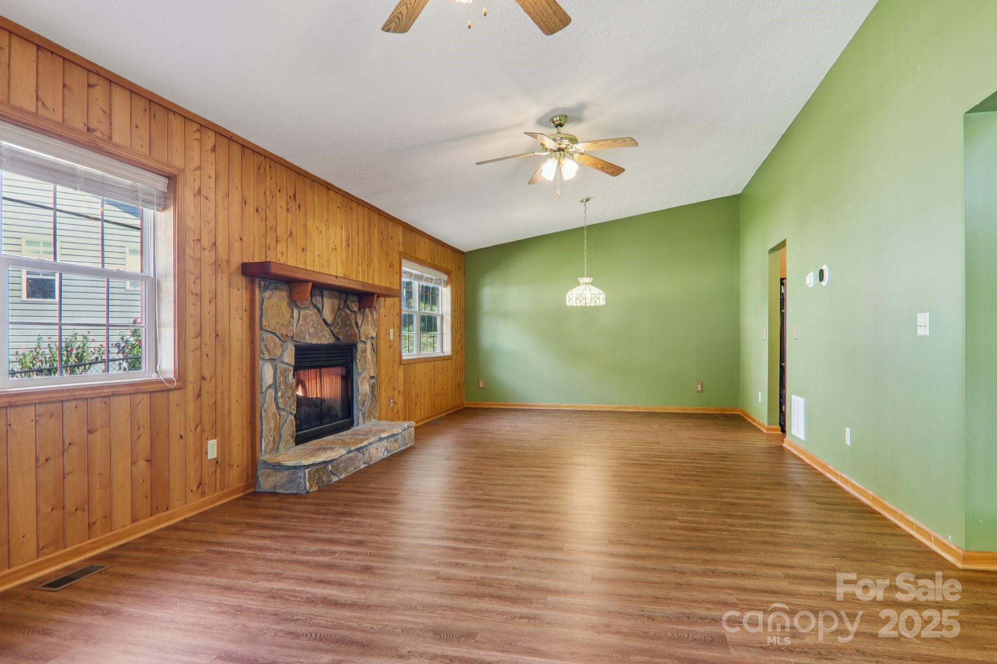 126 Pasco Loop Waynesville, NC 28785 - Photo 6 of 44 wooden floor in an empty room with a window