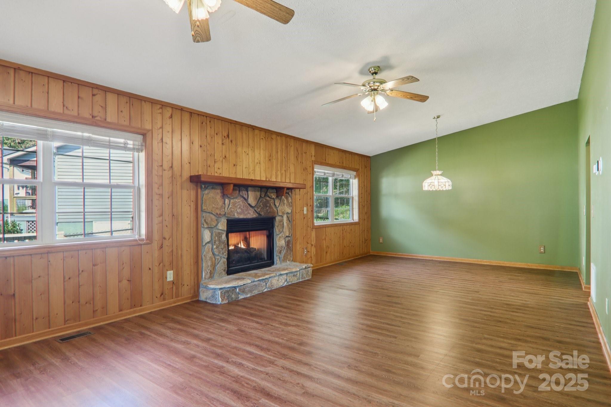 126 Pasco Loop Waynesville, NC 28785 - Photo 9 of 44 wooden floor in an empty room with a window