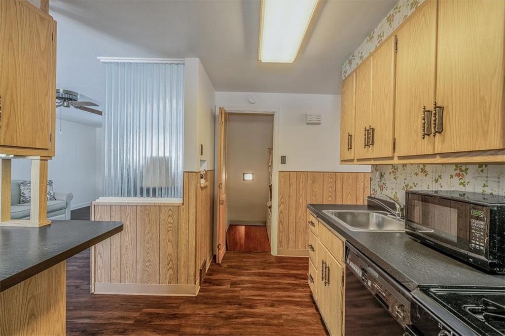 910 Foster Road Clairton, PA 15025 - Photo 12 of 50 a kitchen with stainless steel appliances granite countertop a sink and a stove