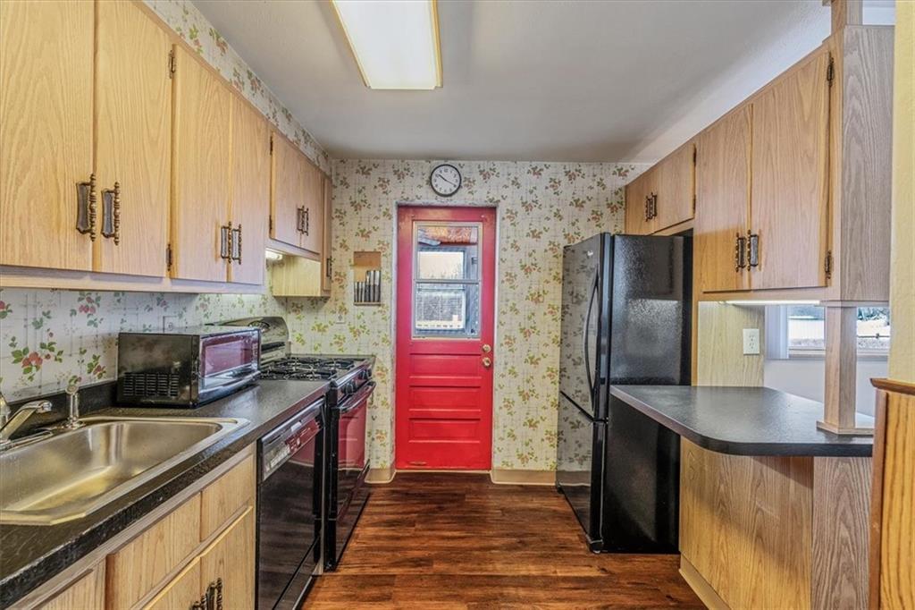 910 Foster Road Clairton, PA 15025 - Photo 13 of 50 a kitchen with stainless steel appliances granite countertop a refrigerator and a stove