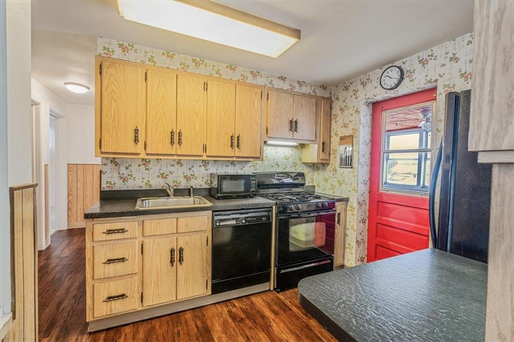 910 Foster Road Clairton, PA 15025 - Photo 14 of 50 a kitchen with stainless steel appliances granite countertop a stove and a sink