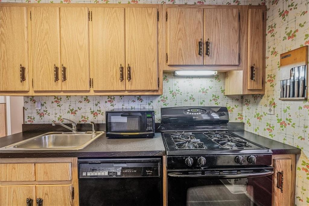 910 Foster Road Clairton, PA 15025 - Photo 15 of 50 a stove top oven sitting inside of a kitchen