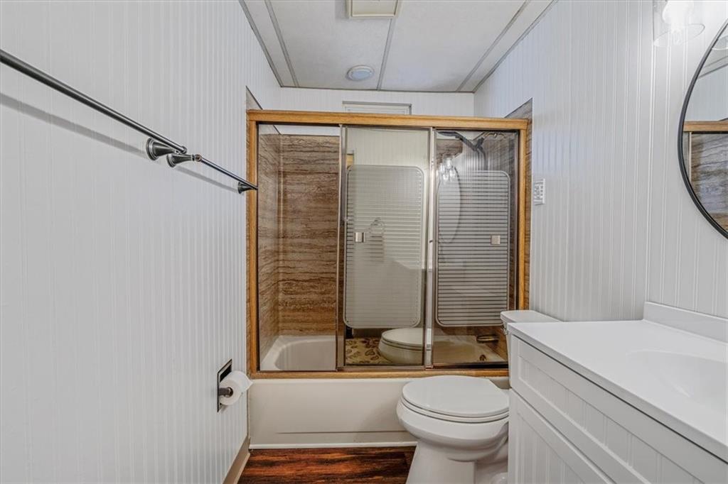 910 Foster Road Clairton, PA 15025 - Photo 20 of 50 a bathroom with a granite countertop toilet sink and shower