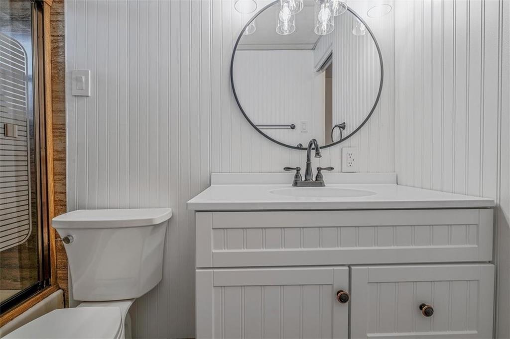 910 Foster Road Clairton, PA 15025 - Photo 21 of 50 a bathroom with a sink a toilet and a mirror