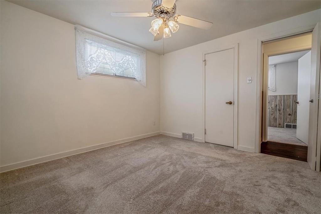 910 Foster Road Clairton, PA 15025 - Photo 23 of 50 an empty room with windows and closet