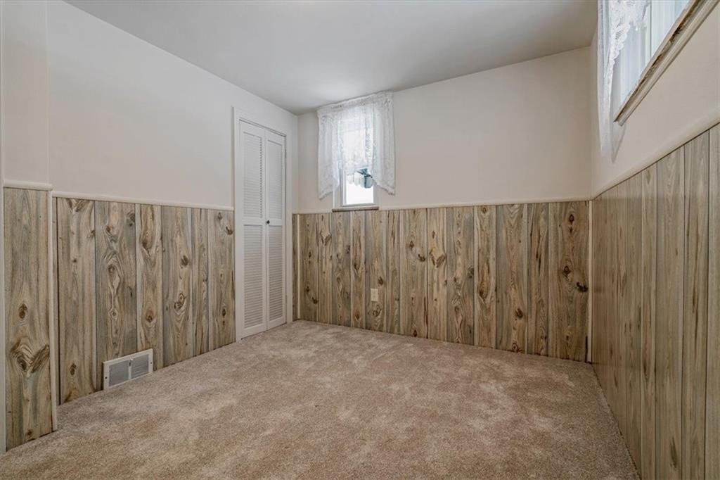 910 Foster Road Clairton, PA 15025 - Photo 26 of 50 a view of an empty room with wooden walls