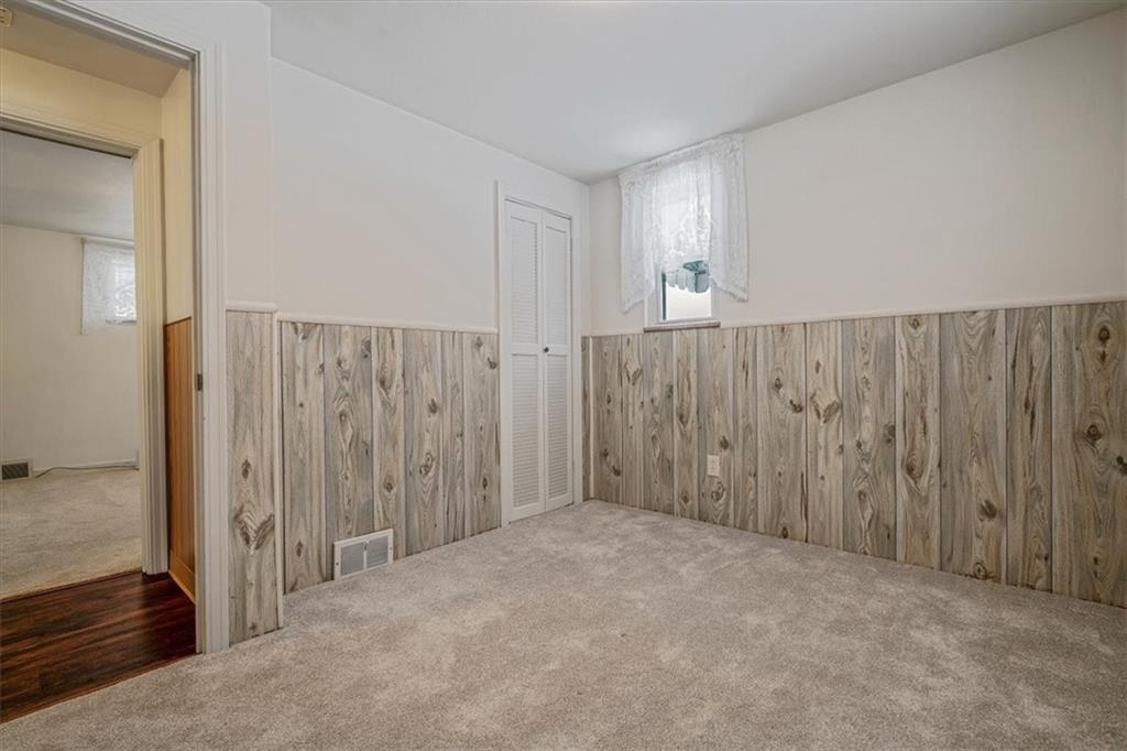 910 Foster Road Clairton, PA 15025 - Photo 27 of 50 a view of an empty room with wooden floor