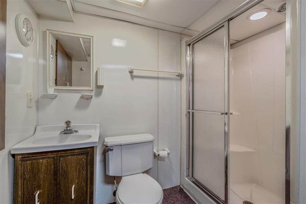 910 Foster Road Clairton, PA 15025 - Photo 32 of 50 a bathroom with a sink a toilet and shower
