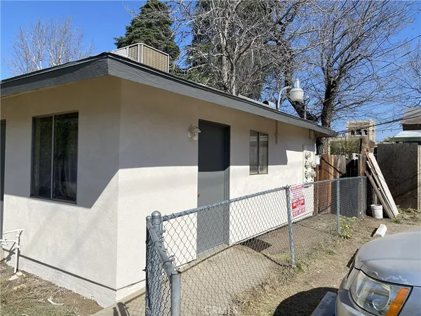 a view of outdoor kitchen with seating area
