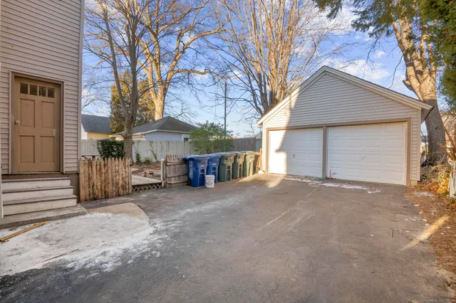 a view of a house with a yard and garage