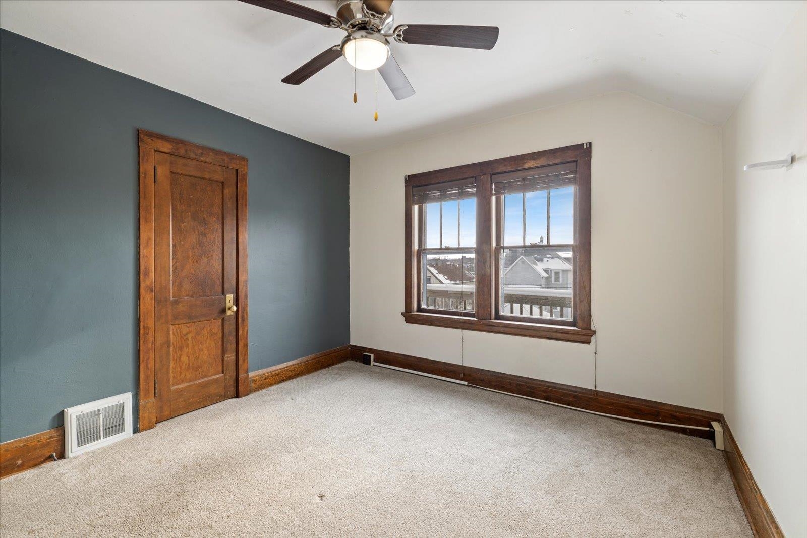3070 Restormel Street Duluth, MN 55806 - Photo 12 of 48 Carpeted spare room featuring a ceiling fan and vaulted ceiling