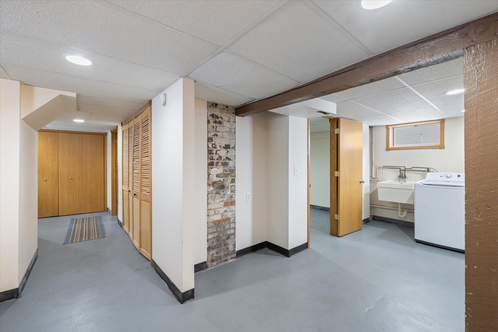 3070 Restormel Street Duluth, MN 55806 - Photo 25 of 48 Finished below grade area with a drop ceiling and washer / dryer