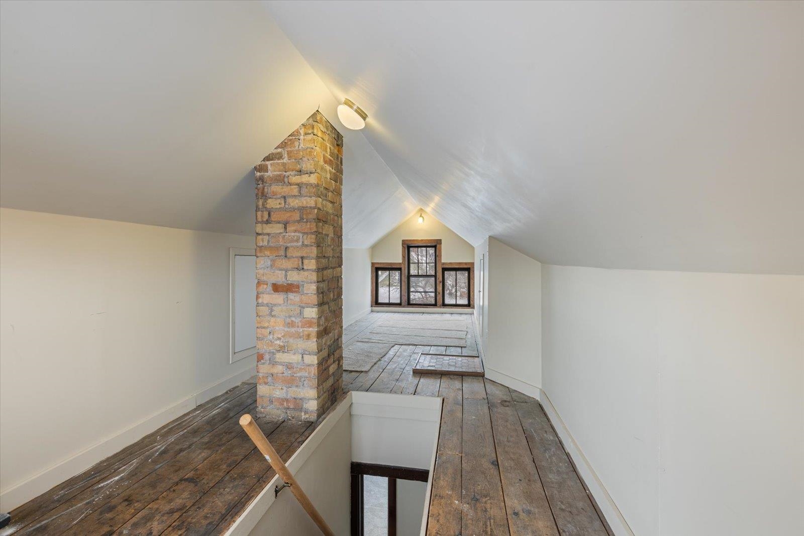 3070 Restormel Street Duluth, MN 55806 - Photo 30 of 48 Bonus room featuring dark wood-style flooring and baseboards