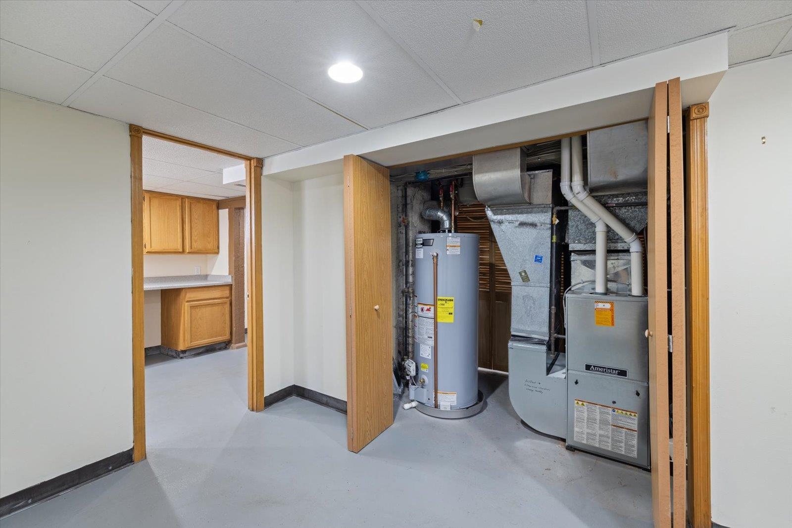 3070 Restormel Street Duluth, MN 55806 - Photo 32 of 48 Utility room with water heater and heating unit