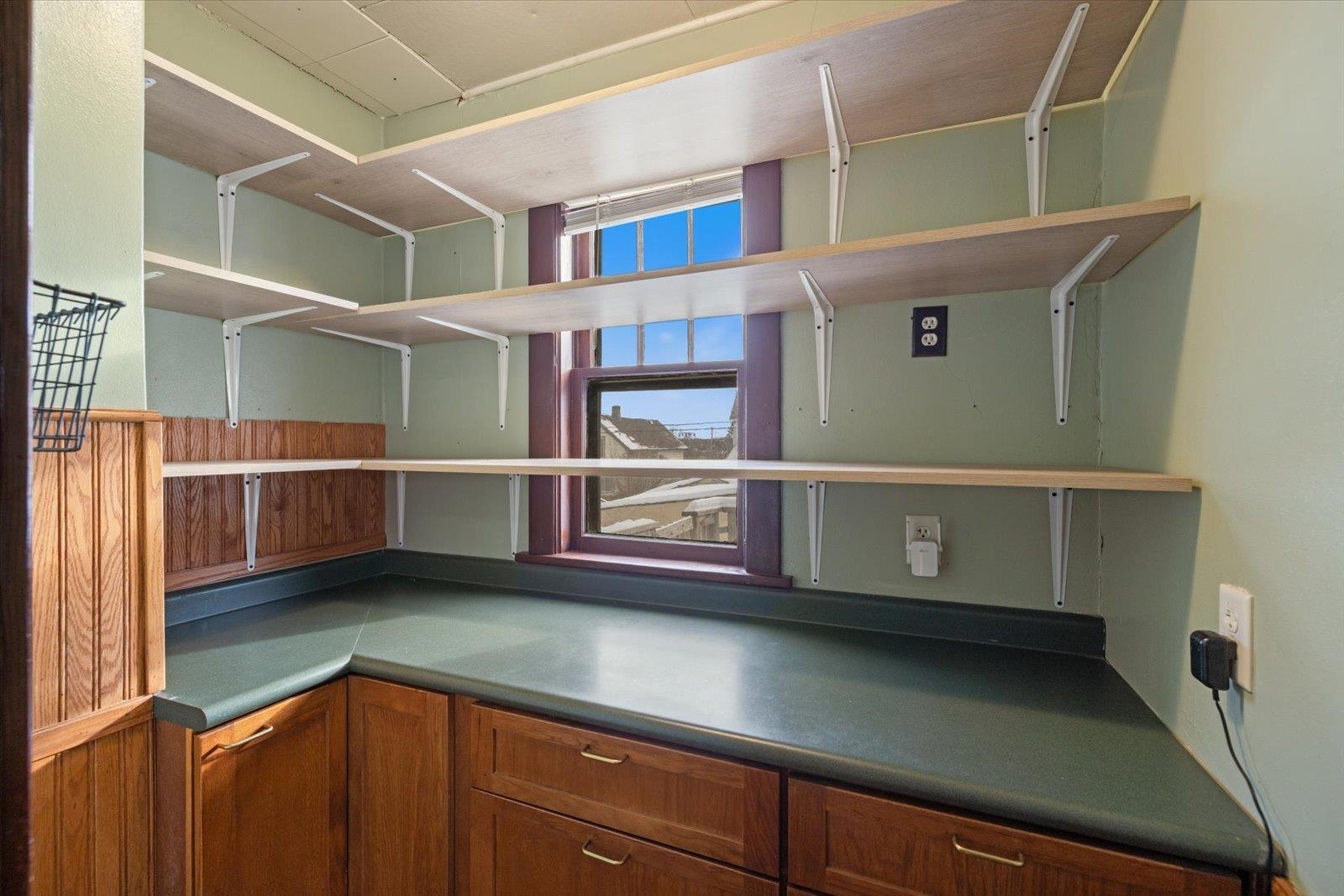 3070 Restormel Street Duluth, MN 55806 - Photo 10 of 48 Kitchen with wood finish cabinets and dark countertops