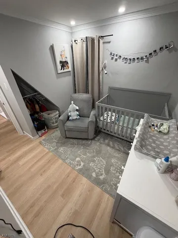 a bed room with a bed and a television