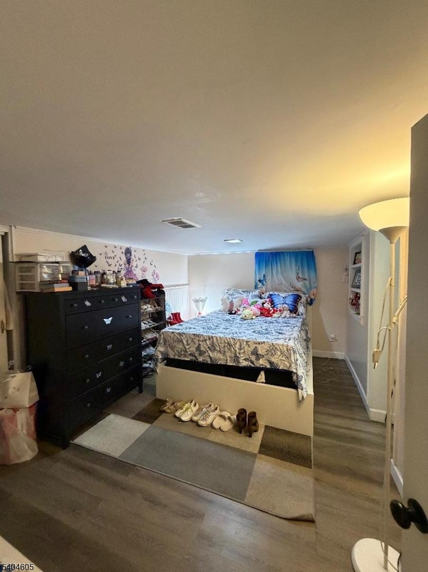 1090 Salem Road Union, NJ 07083 - Photo 21 of 45 a bed room with a bed and a dresser