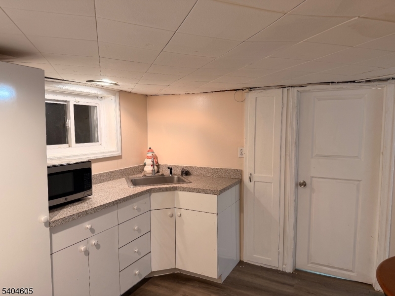 1090 Salem Road Union, NJ 07083 - Photo 25 of 44 a kitchen with granite countertop cabinets stainless steel appliances and a counter space