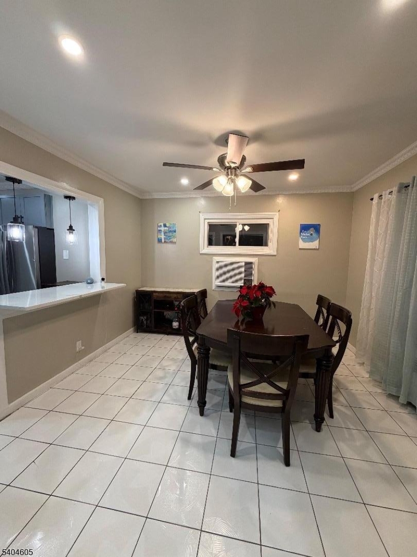 1090 Salem Road Union, NJ 07083 - Photo 8 of 45 a view of a dining room with furniture and chandelier