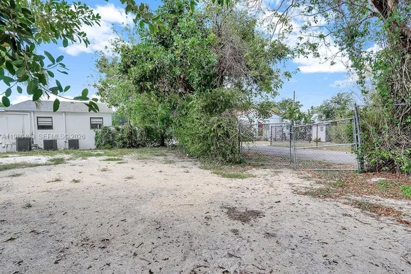 a kitchen with a stove top oven and cabinets