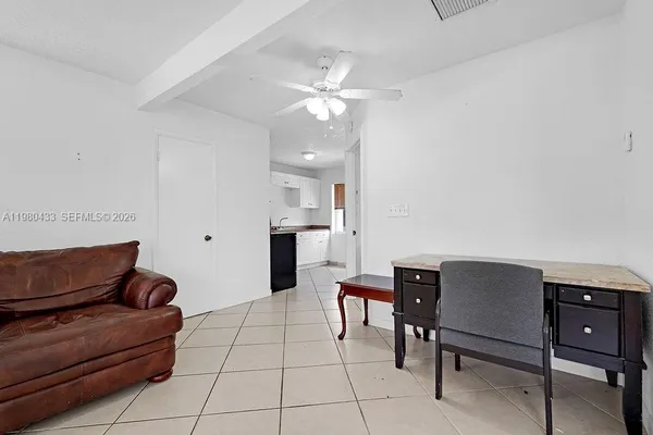 a bedroom with furniture and window