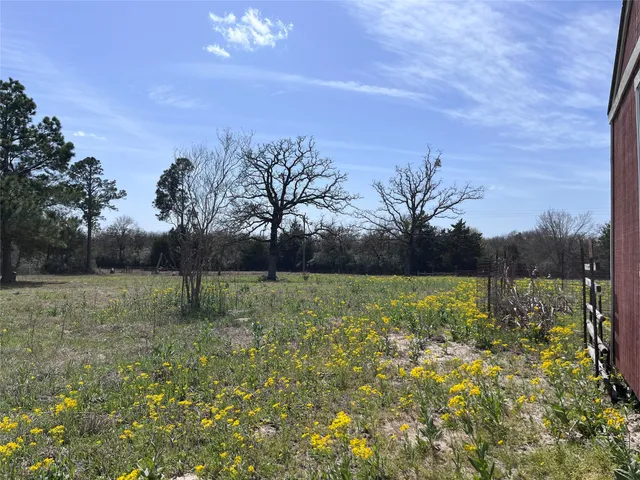 a view of a lake with a big yard