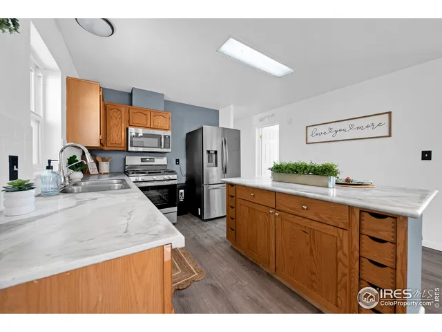 a kitchen with a sink cabinets and window