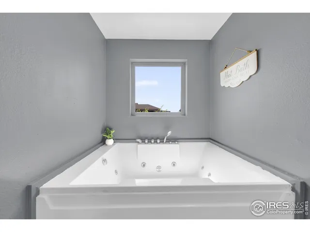 a view of kitchen with wooden floor washer and dryer