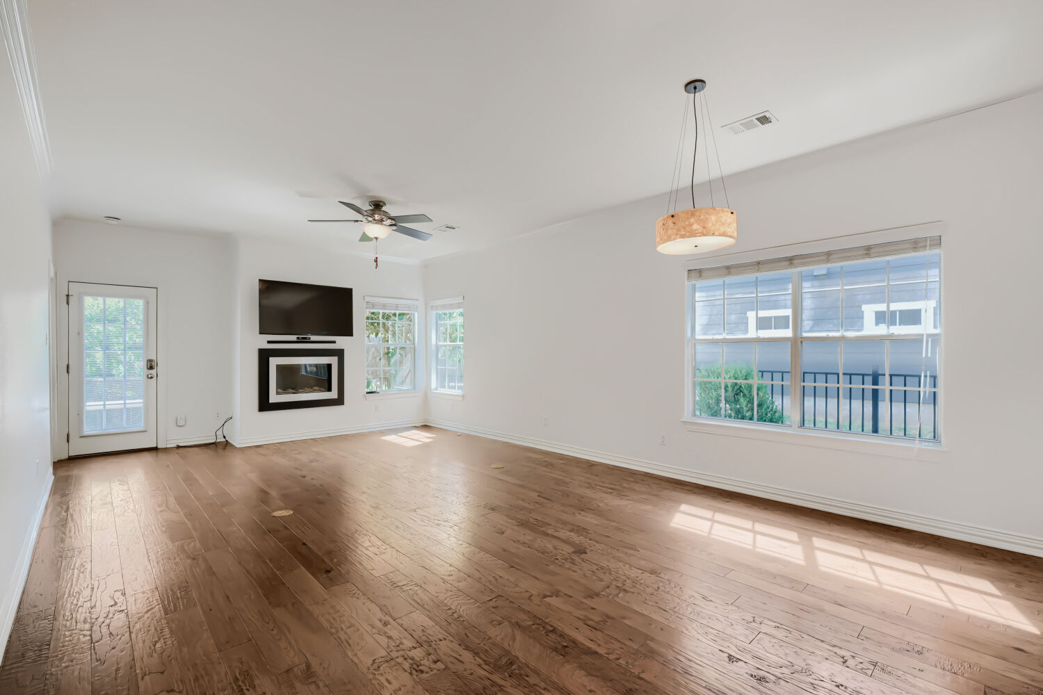 6715 Windrift Way, Unit 28 Austin, TX 78745 - Photo 6 of 19 Open concept from kitchen to dining, with remote control fireplace