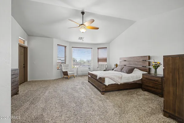 a bedroom with a bed and furniture