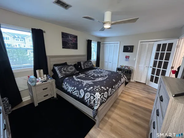 a bed room with a bed and a window