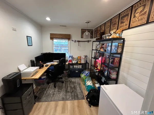 a living room with lots of furniture and a wooden floor