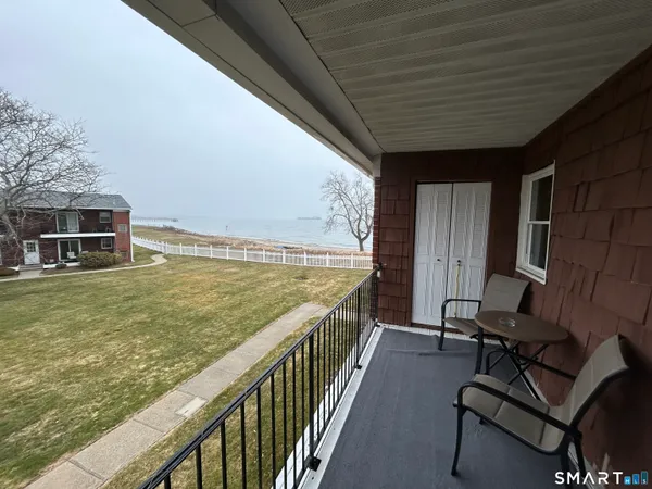 a car parked in front of a big house