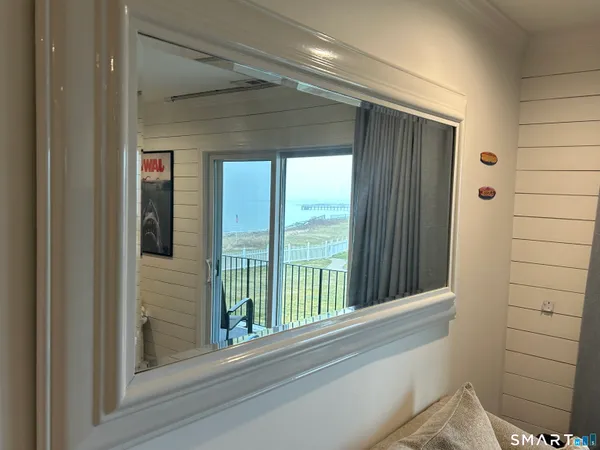 a view of a door and a window