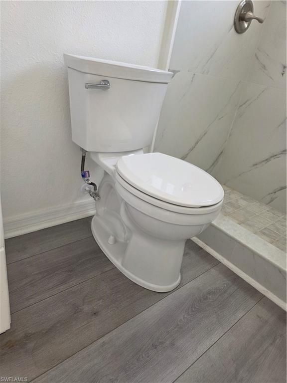 1 Knights Bridge Road, Unit A1 Naples, FL 34112 - Photo 14 of 25 a white toilet sitting next to a white sink