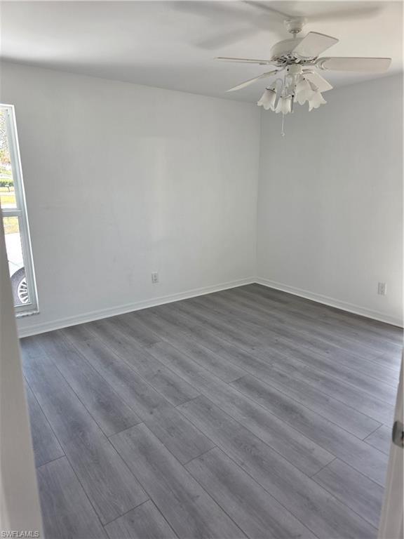 1 Knights Bridge Road, Unit A1 Naples, FL 34112 - Photo 17 of 25 wooden floor in an empty room
