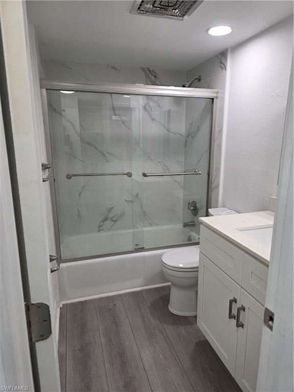 1 Knights Bridge Road, Unit A1 Naples, FL 34112 - Photo 19 of 25 a bathroom with a toilet a sink and shower