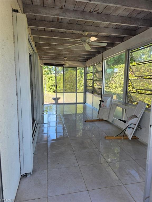 1 Knights Bridge Road, Unit A1 Naples, FL 34112 - Photo 20 of 25 a living room with furniture and large windows