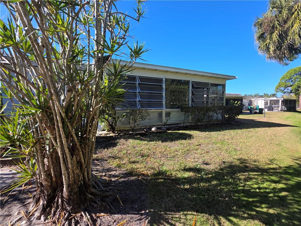 1 Knights Bridge Road, Unit A1 Naples, FL 34112 - Photo 5 of 25 a view of a house with yard covered in snow