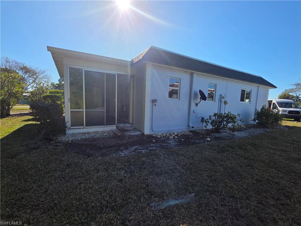 1 Knights Bridge Road, Unit A1 Naples, FL 34112 - Photo 6 of 25 a backyard of house with garden