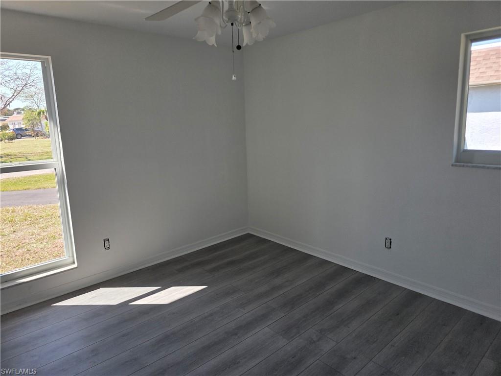 1 Knights Bridge Road, Unit A1 Naples, FL 34112 - Photo 10 of 25 an empty room with a window