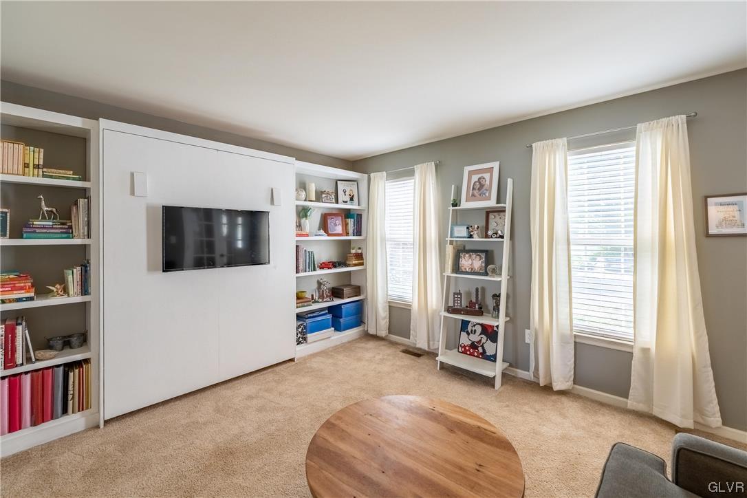 4556 Brighton Road Lower Macungie Township, PA 18062 - Photo 22 of 48 a living room with furniture and a book shelf