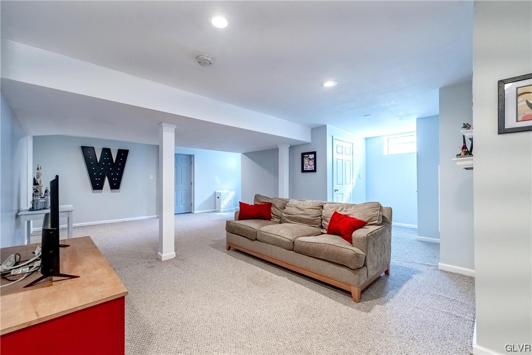 4556 Brighton Road Lower Macungie Township, PA 18062 - Photo 25 of 48 a living room with furniture and a flat screen tv