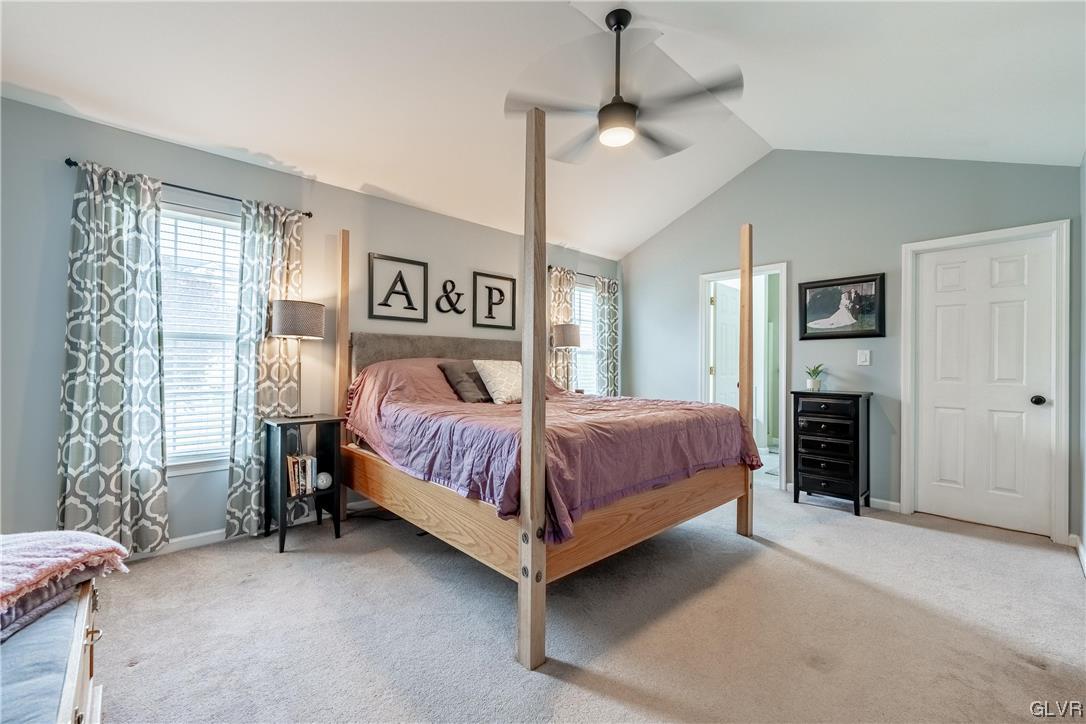 4556 Brighton Road Lower Macungie Township, PA 18062 - Photo 29 of 48 a spacious bedroom with a bed chandelier and a window