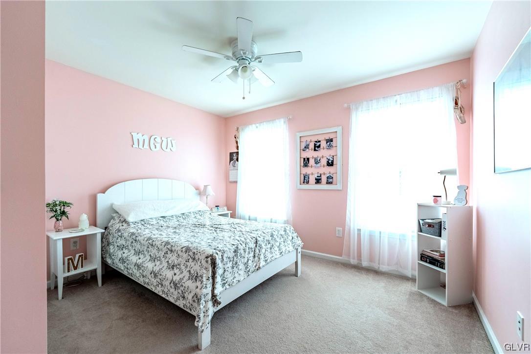 4556 Brighton Road Lower Macungie Township, PA 18062 - Photo 32 of 48 a bedroom with a bed and a chandelier