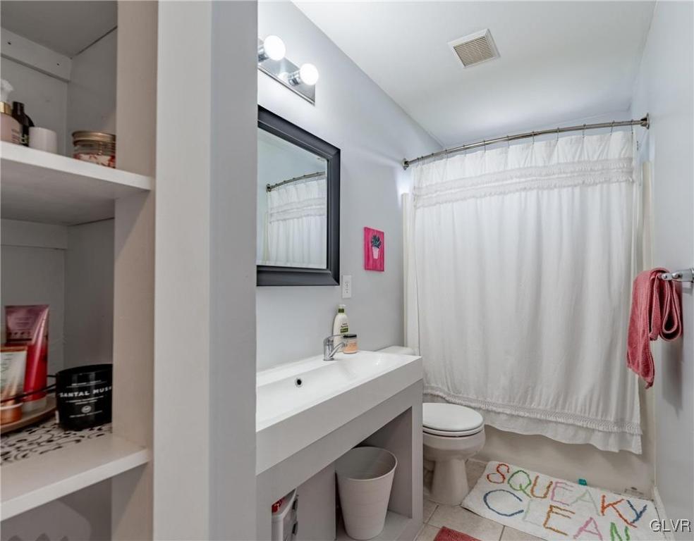 4556 Brighton Road Lower Macungie Township, PA 18062 - Photo 37 of 48 a bathroom with a sink toilet and shower