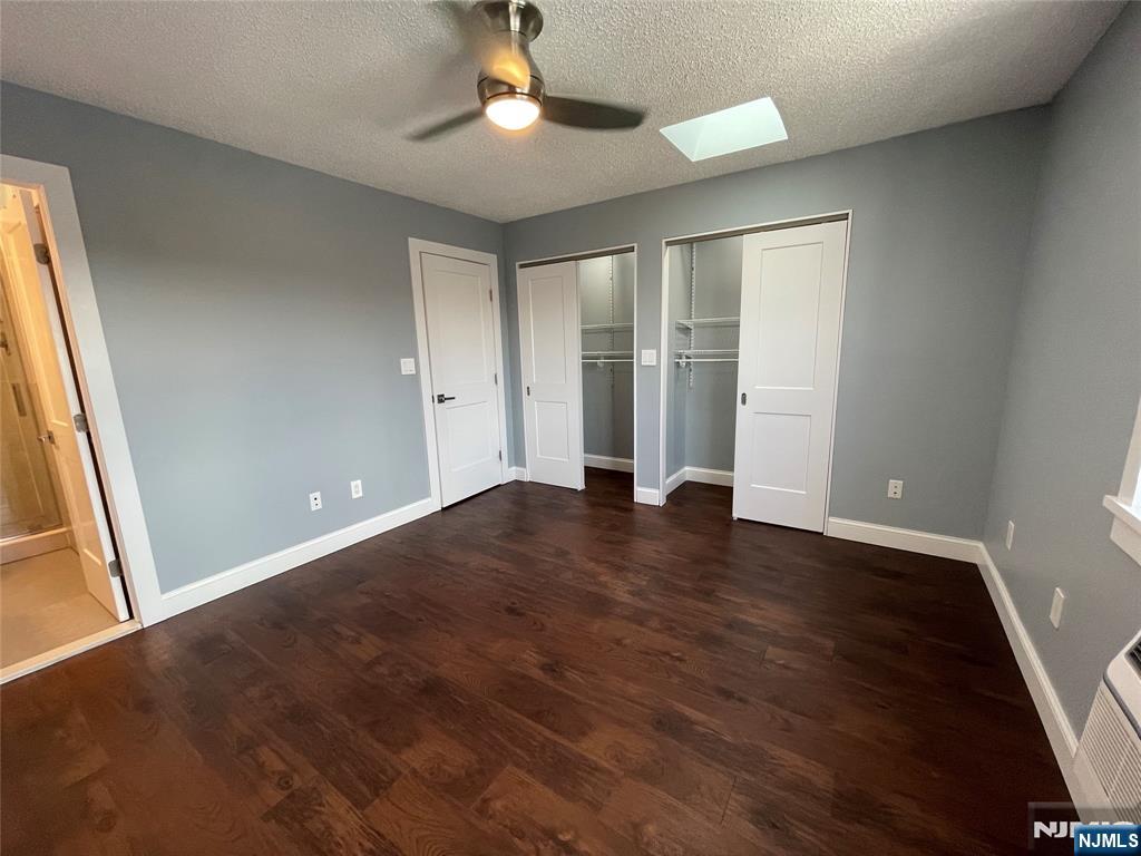 52 Reilly Court, Unit 1 Hackensack, NJ 07601 - Photo 20 of 25 an empty room with wooden floor and windows